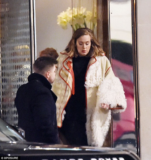 236BA81800000578-2846421-Hot_stuff_Wearing_a_white_fur_coat_with_a_black_jumpsuit_the_Rol-8_1416769062426