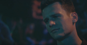 Patrick in Looking - The Movie trailer looking nostalgically at someone in a club