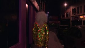 A drag queen walking into the Only Gay Bar In The Village