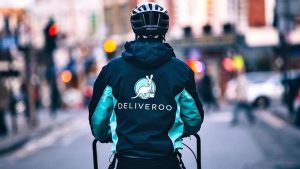 Deliveroo driver on their way with food that somebody paid for with their deliveroo voucher
