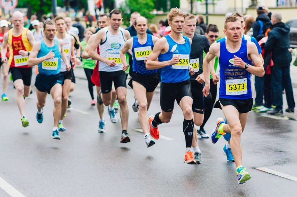 Man running in a marathon which is a metaphor for being in a gay long distance relationship