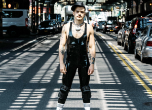 RECON home screen with a fetish guy in rubber for the one of the best gay apps in Ireland for dating in 2016