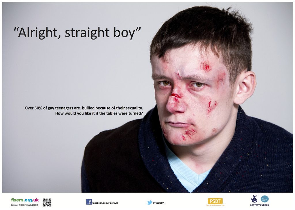 A man bloodied and bruised, with the words alright, straight boy. Reducing homophobic bullying is one of the LGBT issues that could benefit from Apple's €13b tax bill