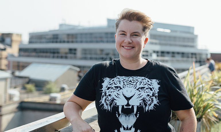 Kate Brennan Harding standing on a sunny rooftop is one of the LGBT people in Real Irish Jobs