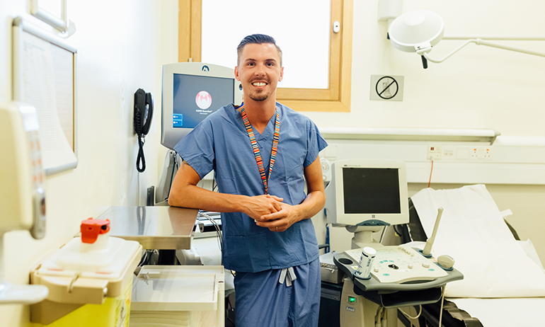 Mikey O'Brian pictured here at a hospital bed is one of the LGBT people in Real Irish Jobs