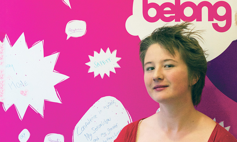 Emmet standing in front of the belong to sign, who is one of the young Irish LGBT interviewed for GCN's 2016 Youth Issue