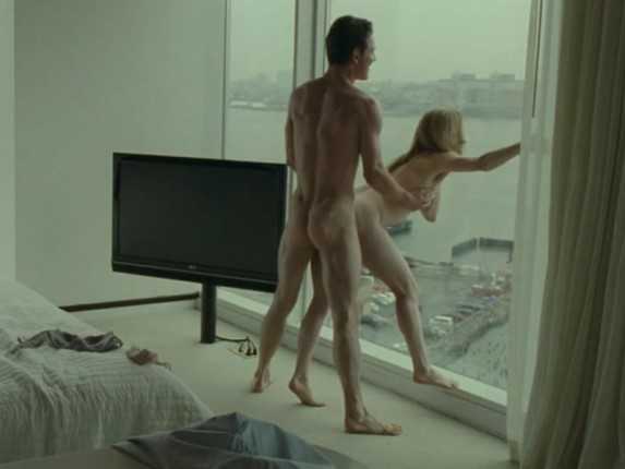 Michael Fassbender naked in Shame having sex against a window with a girl