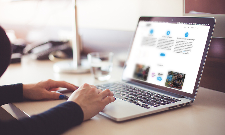 A person at a computer buying PrEP online in in GCN's guide on where tof buy PrEP online