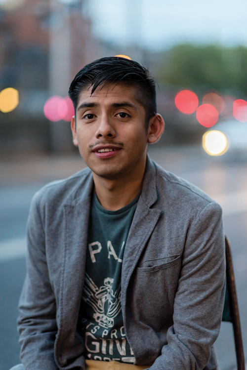 Javier (a gay man of colour) poses for a photo as he discusses racism in Ireland