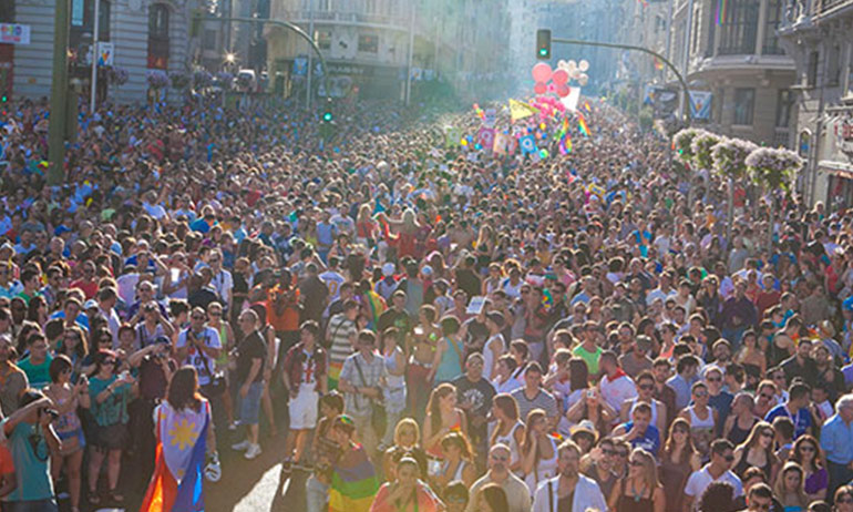 A crowd at the Madrid Pride parade, one of the top ten queer travel events of 2017