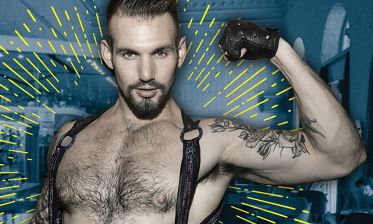 A man flexing his bicep in a harness at Vienna Fetish Spring, one of the top ten queer travel events of 2017