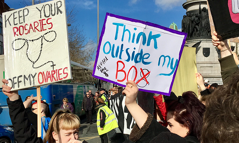 A Strike 4 Repeal sign saying Think outside my box