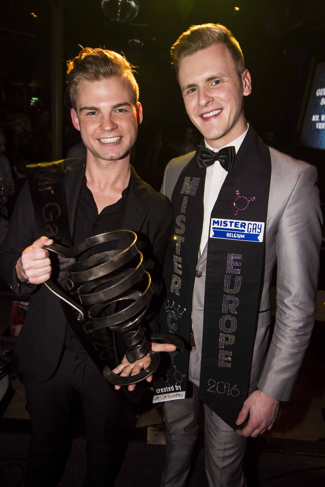 Stephen Lehane holding the MGI cup with the host as the winner of Mr Gay Ireland 2017
