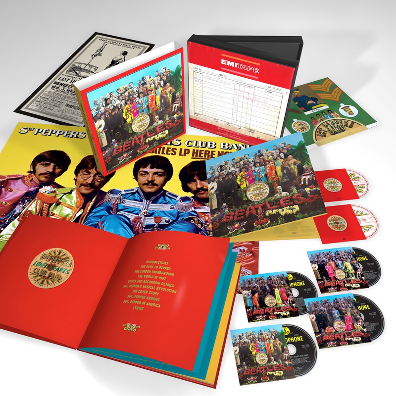The Beatles CDs and LPs laid out on a white table
