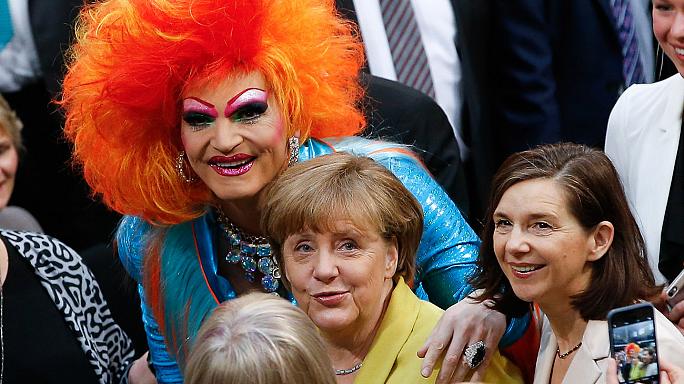 angela merkel and a redhaired drag queen