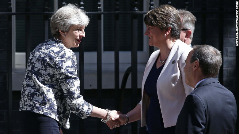 theresa may and arlene foster shake hands outside 10 Downing street