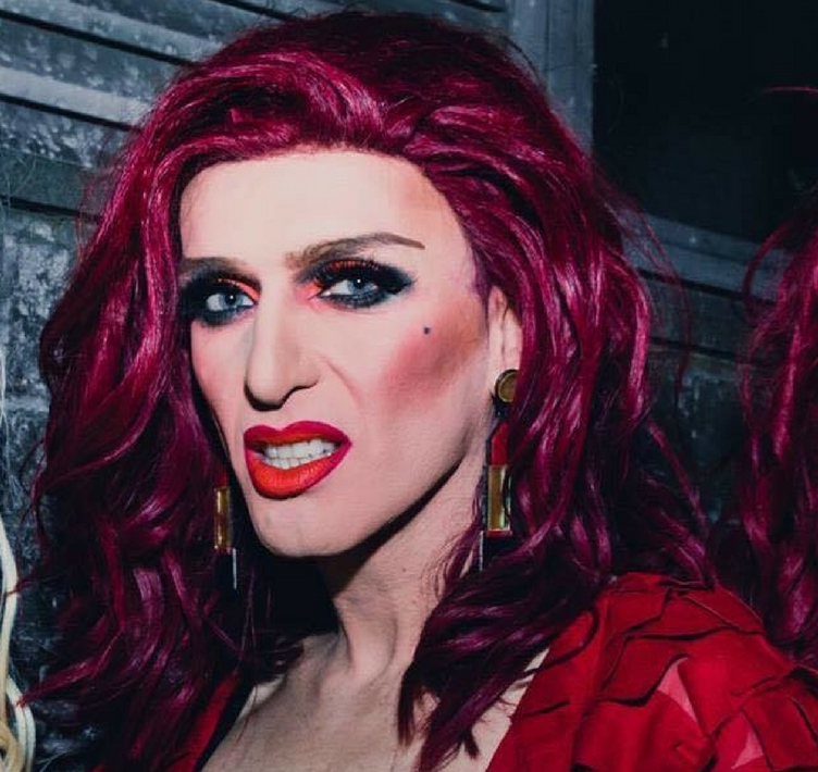 Fiery drag queen red-head Veda Lady posing for the camera