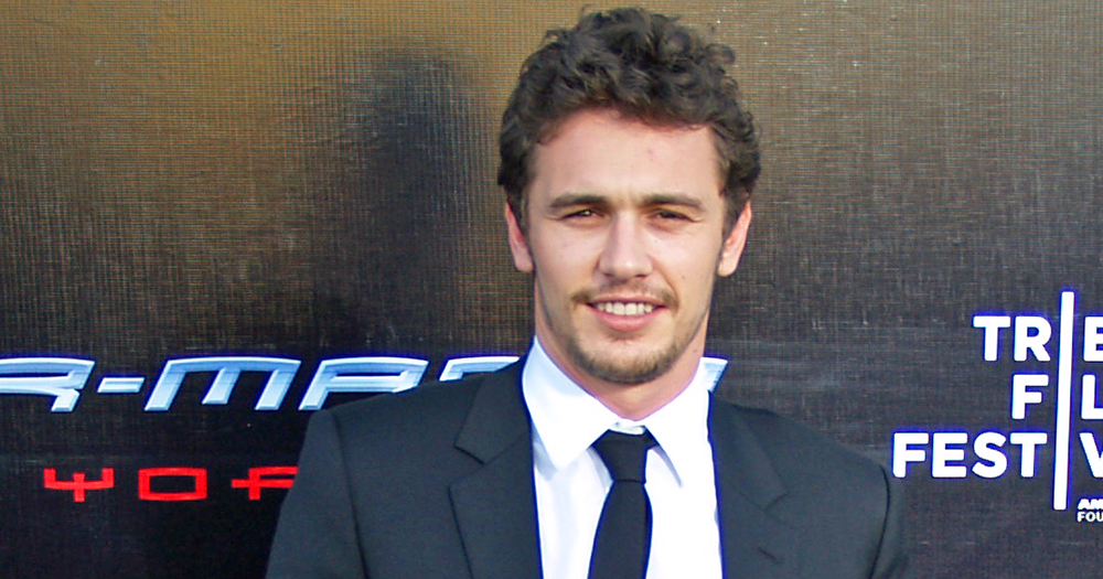 James Franco smiling in a suit.