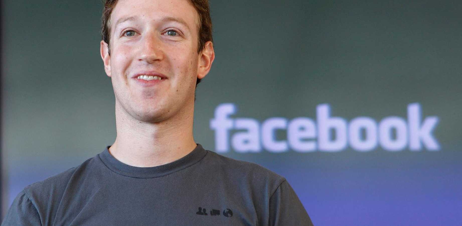Mark Zuckerberg from Facebook smiling in a grey shirt