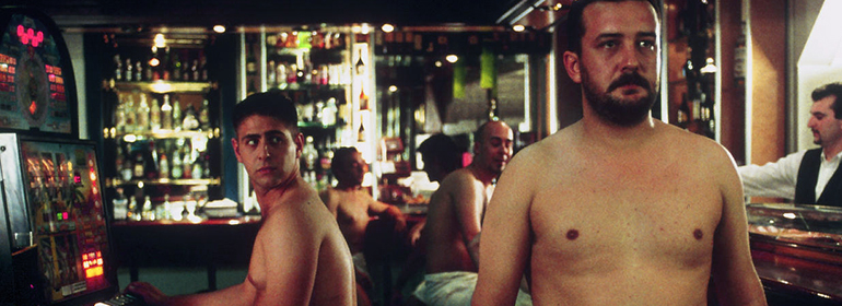 Still frame from Bear cub with men topless in white towels in a bar or sauna