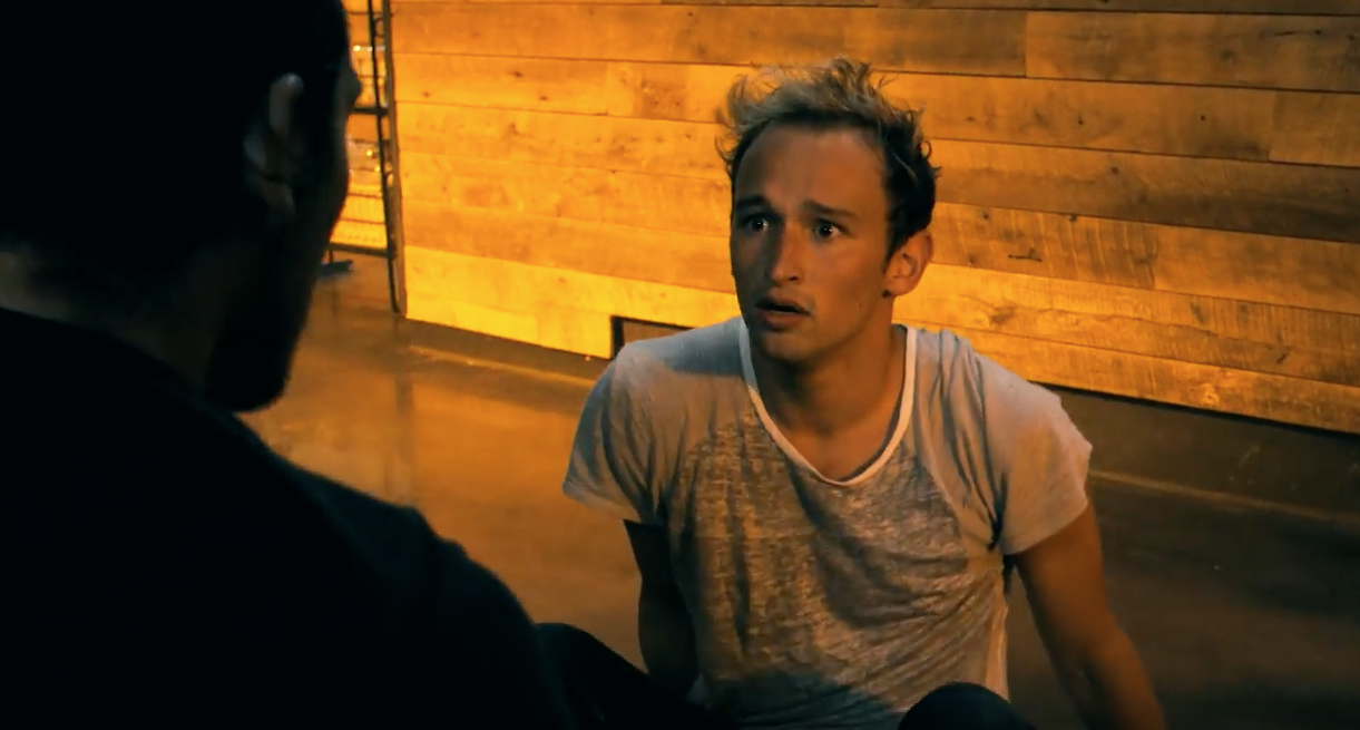 A vulnerable looking male dancer in an homage to Orlando victims