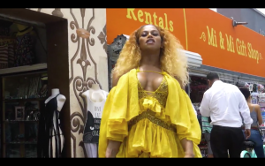 Trans Beyoncé Impersonator in a yellow dress
