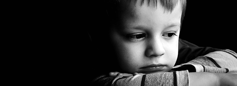 A sad child in black and white because Danny healy-rae doesn't think same-sex couples should be allowed to adopt children