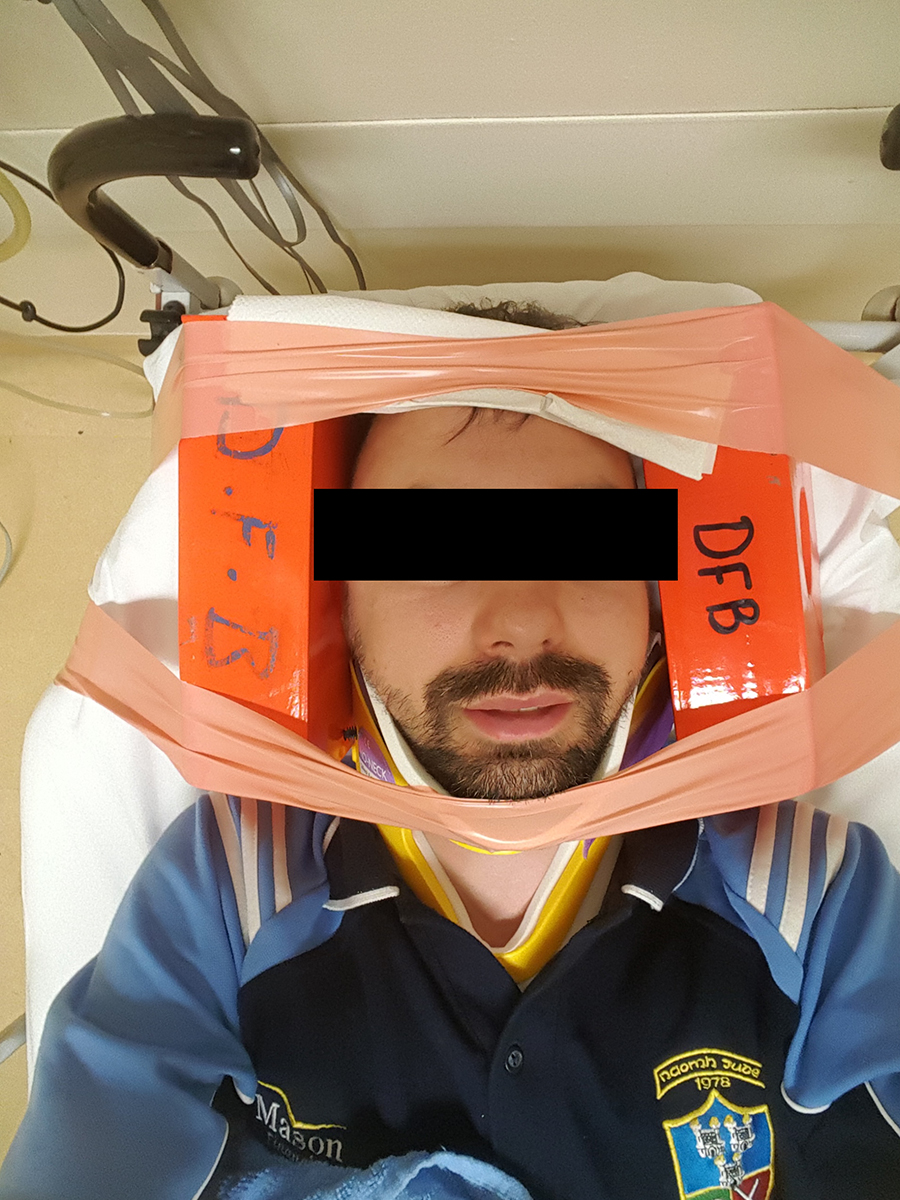Marcin, who suffered a homophobic attack in the Phoenix Park, showing his immobilisation in the hospital