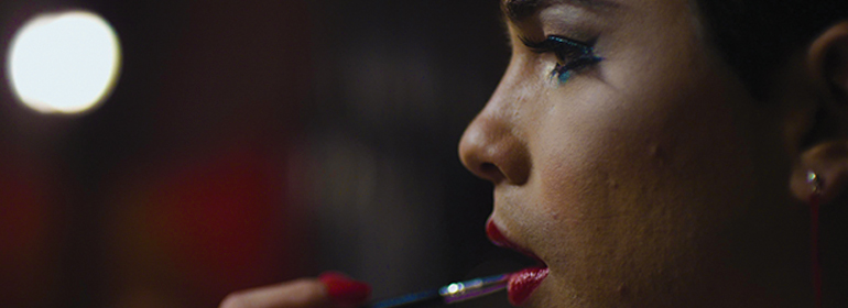 Viva screenshot with Jesus doing his drag makeup wearing red lip gloss