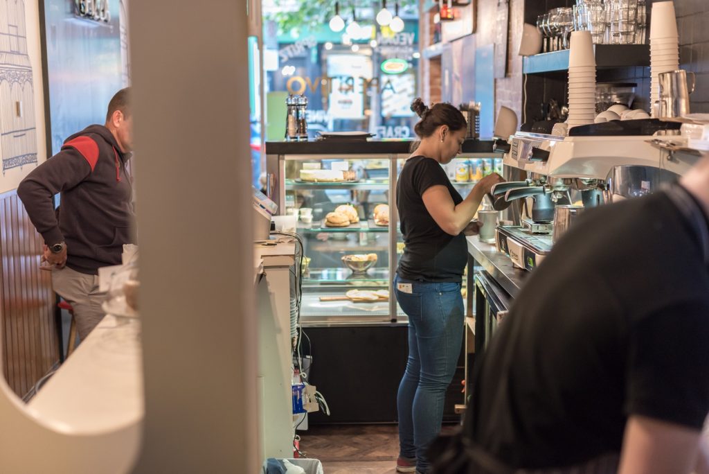 A barista in Aperitvo making coffee
