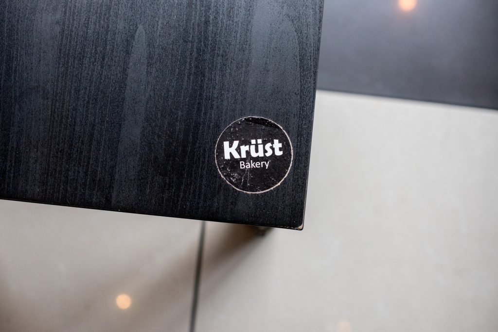 Krüst Bakery's symbol on a table
