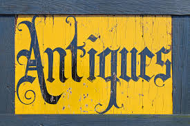 An antiques sign like the national antiques art and vintage fair might have