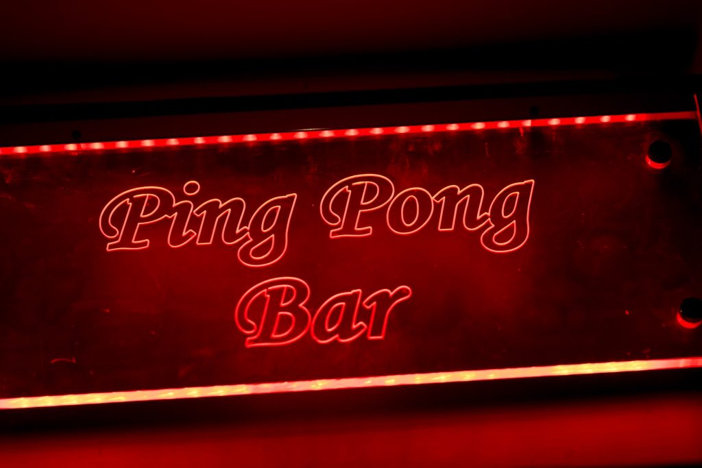 A glowing red sign saying ping pong bar from Yamamori Sushi, who's manager Graham Ryan we interviewed in this month's Amuse Bouche