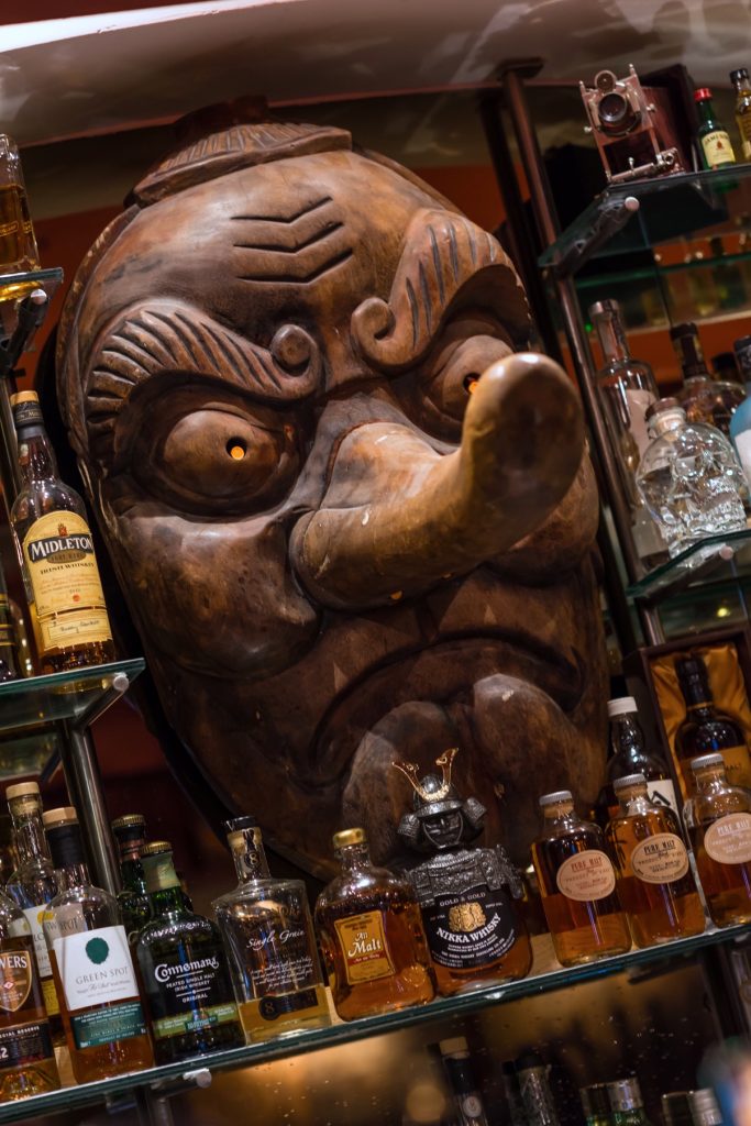 A wooden carved artefact with long nose looking angry from Yamamori Sushi, who's manager Graham Ryan we interviewed in this month's Amuse Bouche