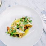 A chicken dish on a white plate at sophie's restaurant at the dean hotel for the November 2016 Amuse Bouche