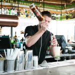 A bartender pouring a cocktail at sophie's restaurant at the dean hotel for the November 2016 Amuse Bouche