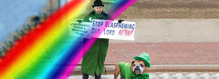 A man in emerald coat holding a sign saying 'a sacrilegious lesbian and homosexual parade' with a dog in a green jacket, hat and bowtie