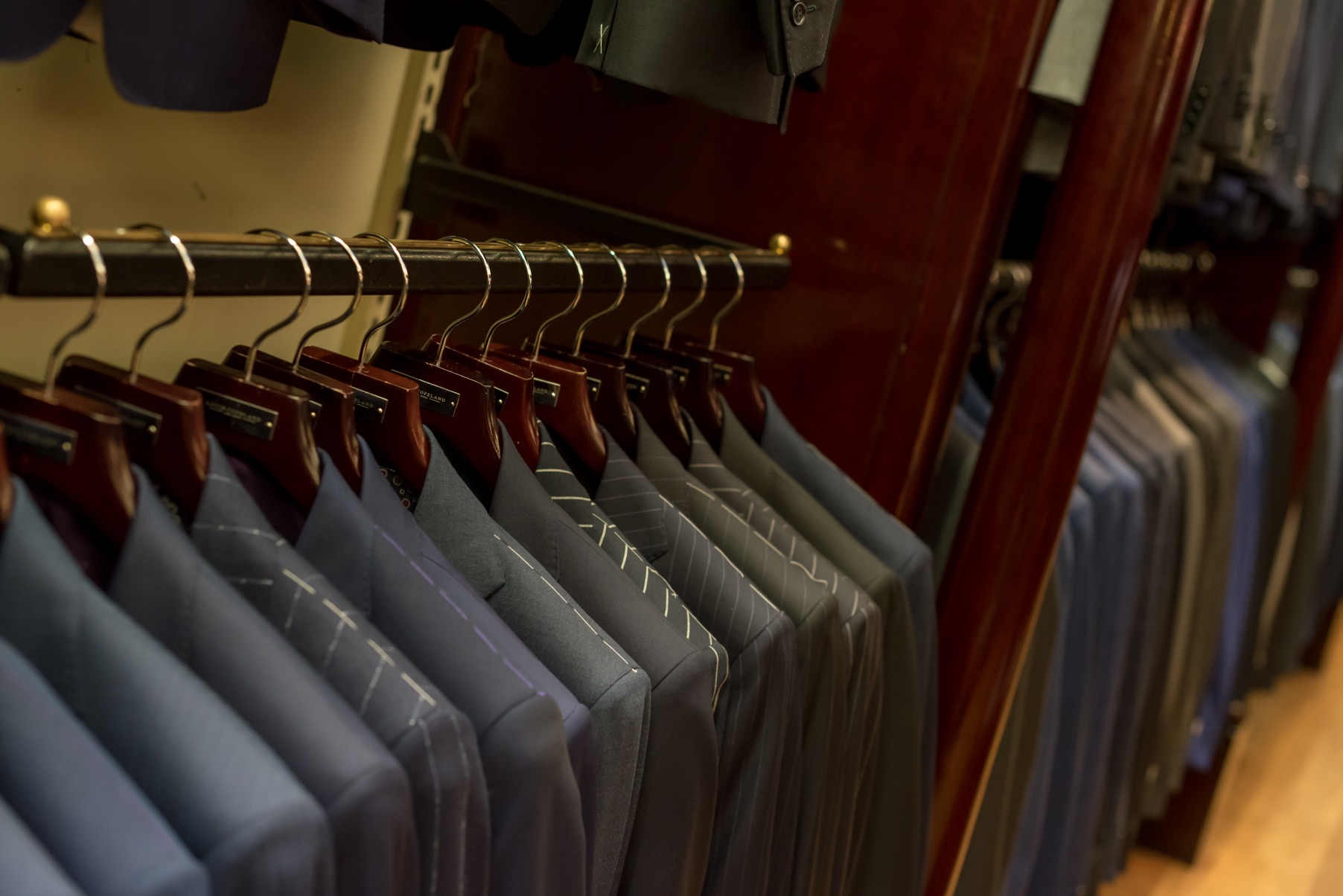 A rack of suits at a Louis Copeland store