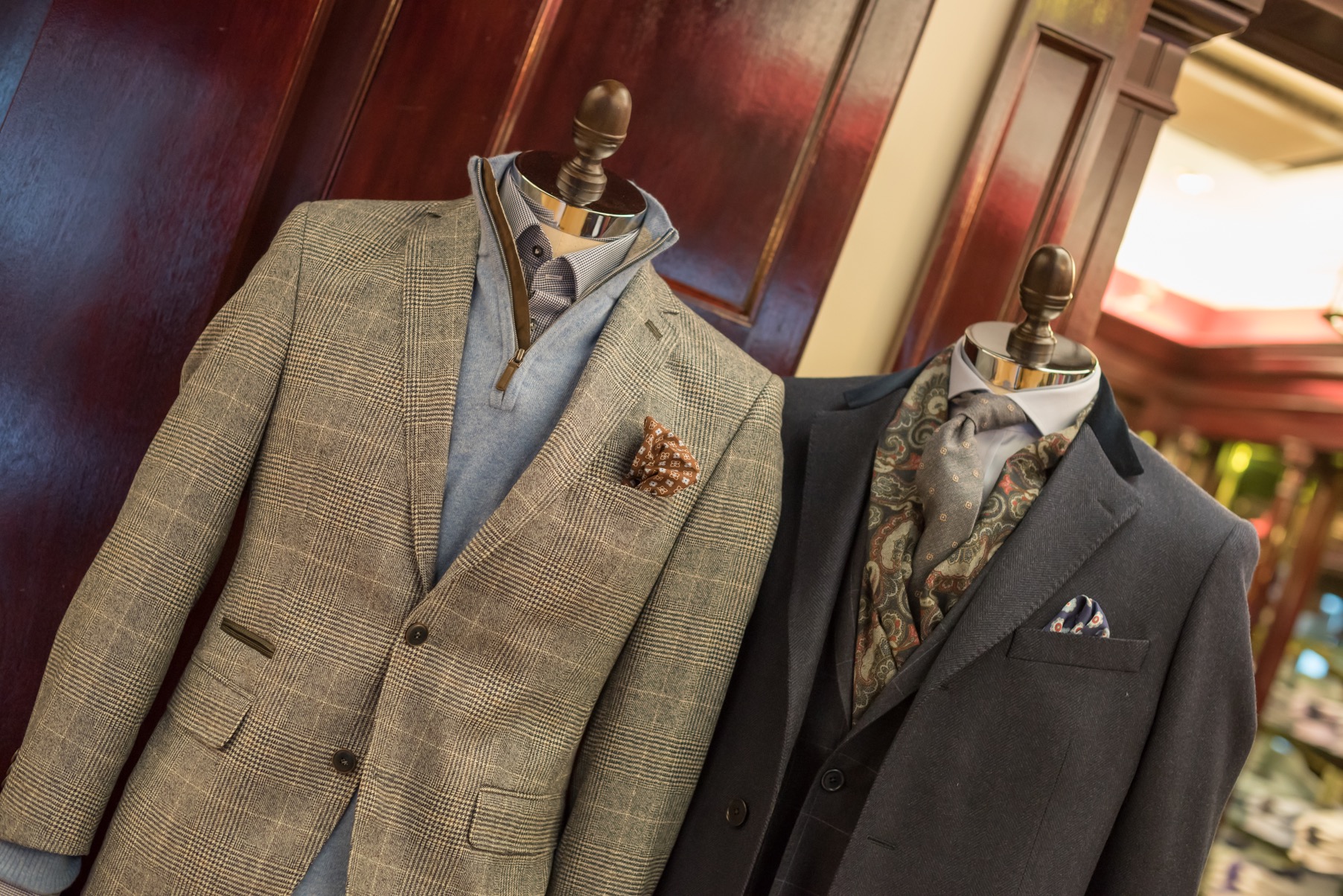 2 suits on mannequins at a Louis Copeland store