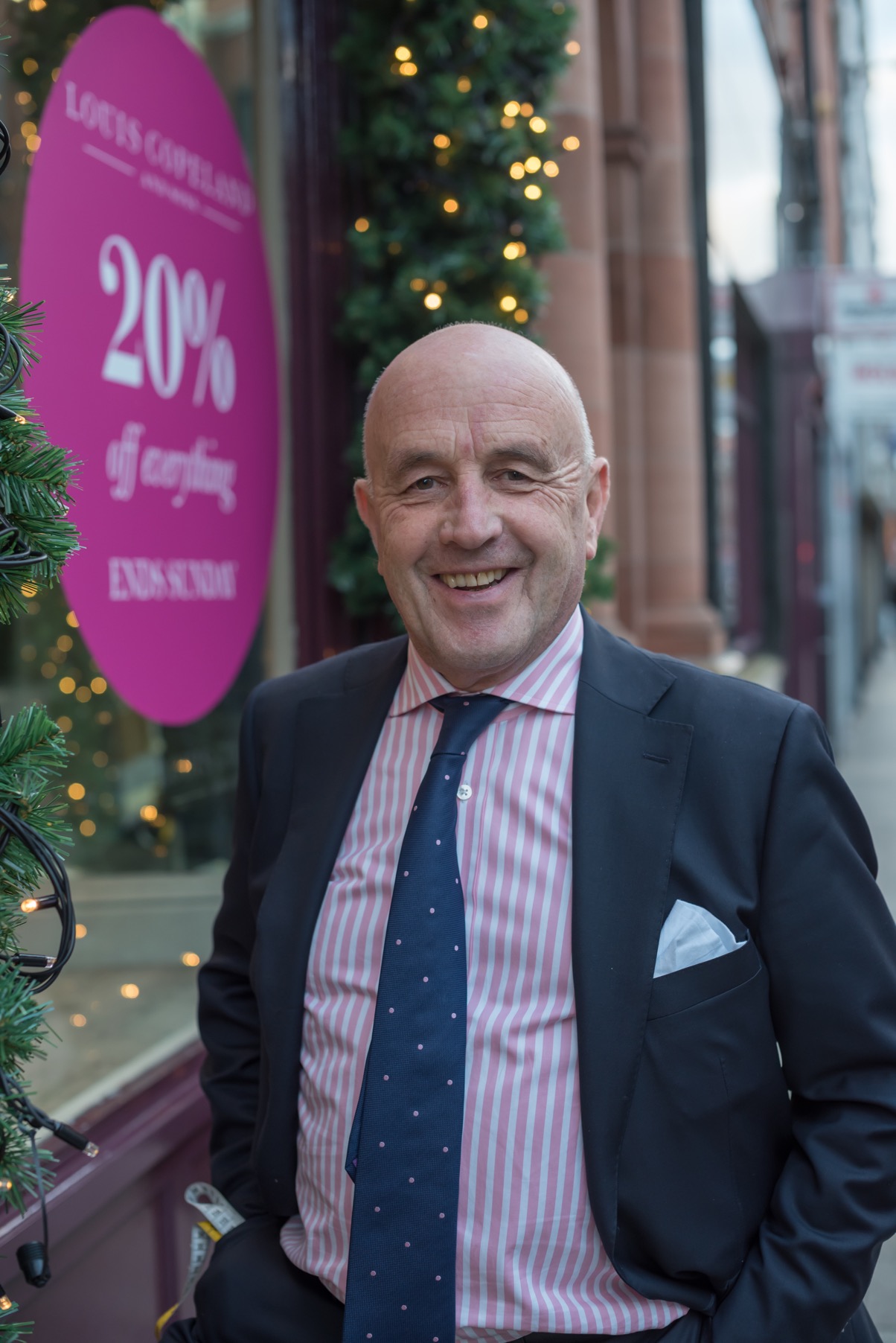 Louis Copeland standing outside his store