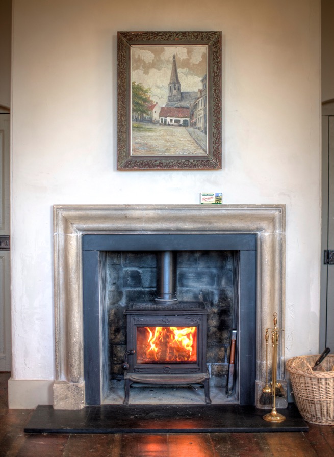 A roaring fire in a fireplace at one of the Irish Landmark Trust venues - the same Irish Landmark Trust who has a Valentine's Giveaway