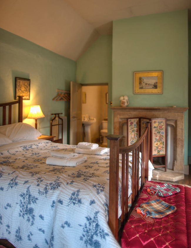 A bedroom with a bed and lamp at one of the Irish Landmark Trust venues - the same Irish Landmark Trust who has a Valentine's Giveaway