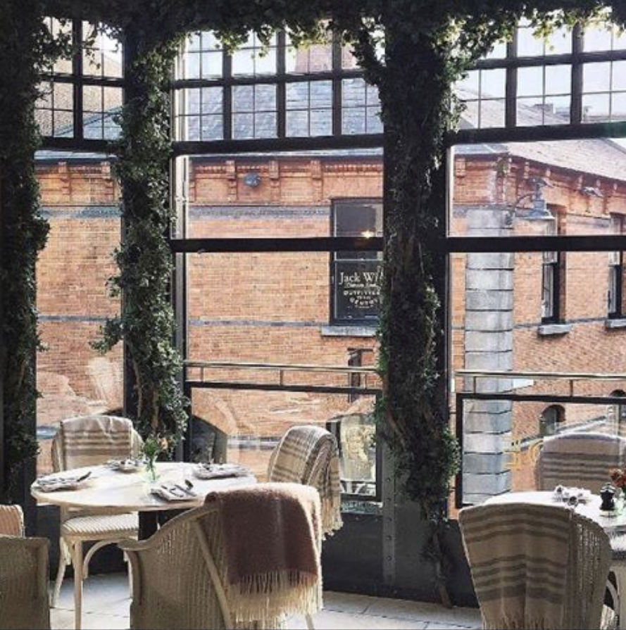 A table overlooking Dublin buildings at Wilde restaurant, the place reviewed by James Kavanagh