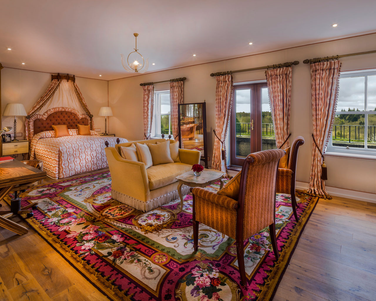 An interior shot of the lodge at ashford castle where if you book a wedding, you could win a luxury cruise to the value of e10000 with chairs, a couch and a bed