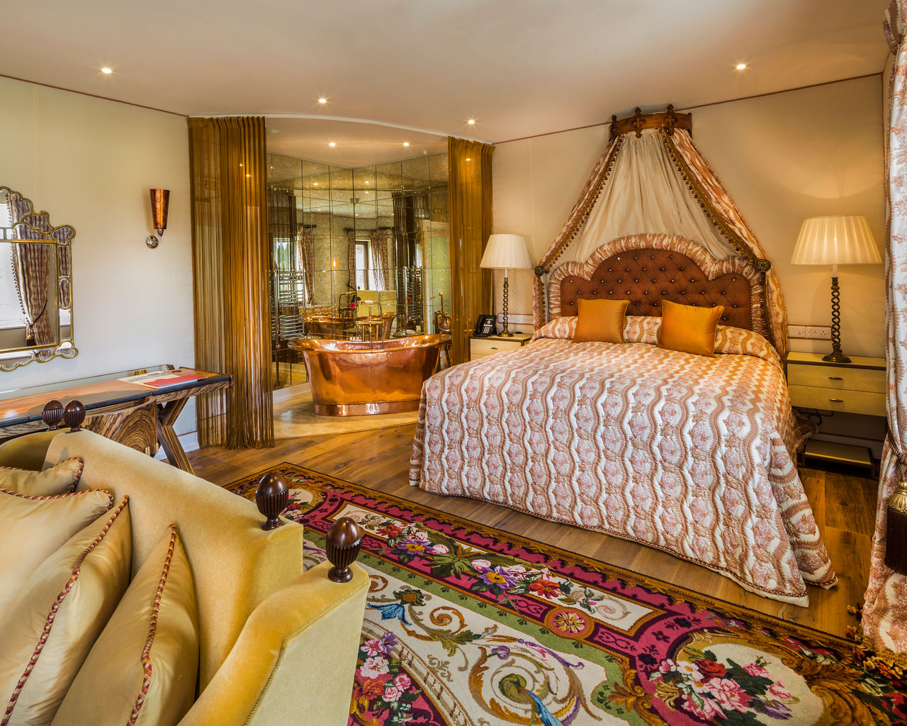 An interior shot of the lodge at ashford castle where if you book a wedding, you could win a luxury cruise to the value of e10000 with a bed, rugs and lamps