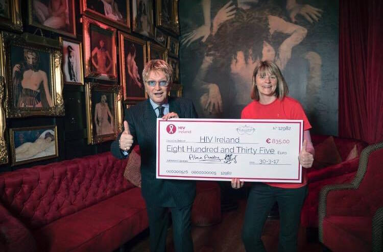 Mr Pussy presenting HIV Ireland with a giant cheque for €835