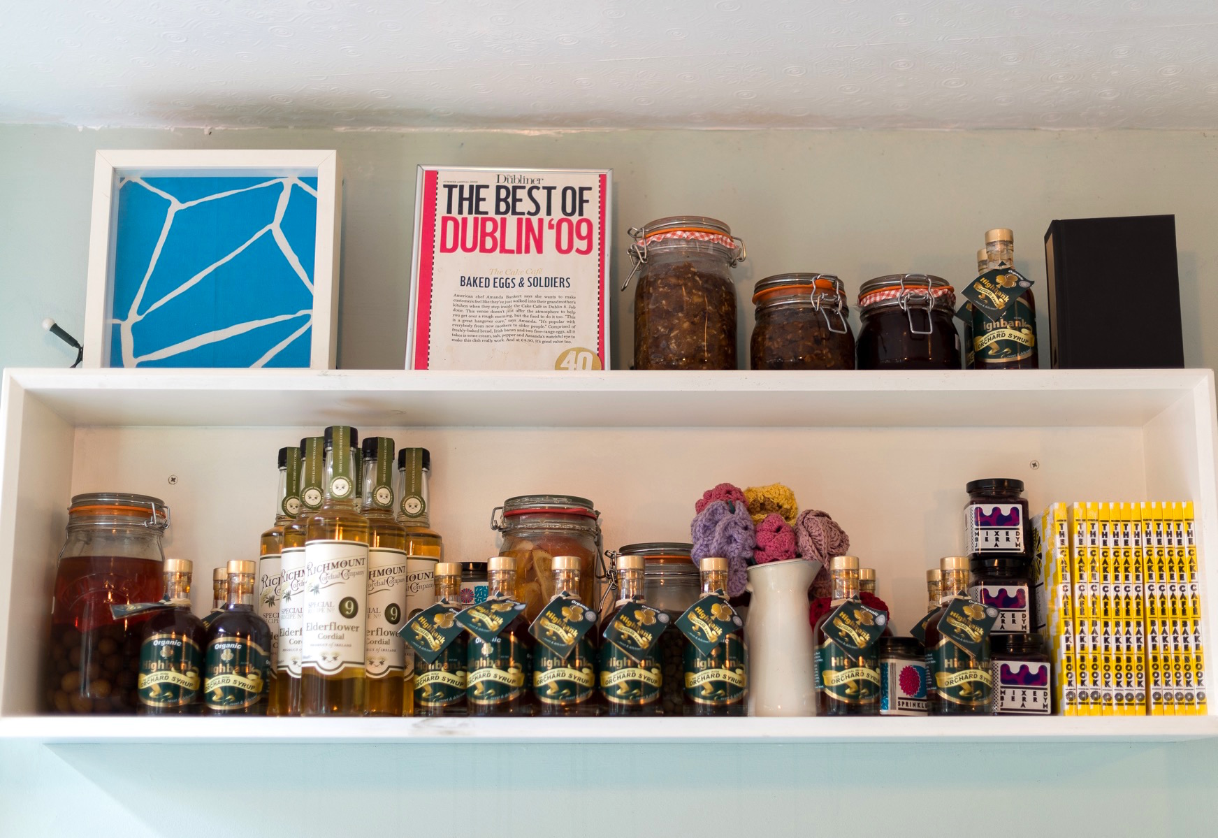 Jars and ingredients on shelves at the cake cafe and slice which are both owned by Ray O'Neill