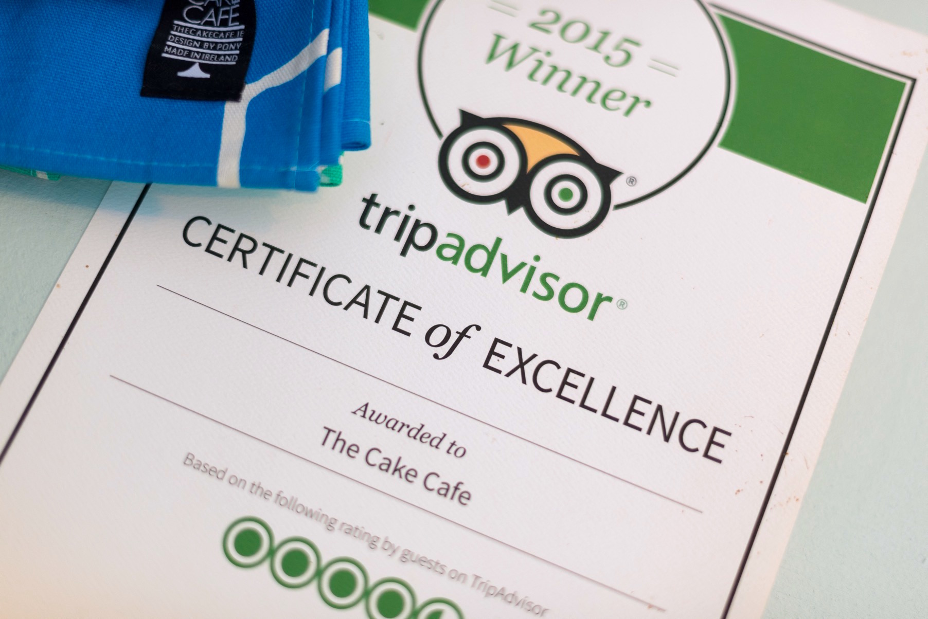 A TripAdvisor certificate of excellence at the cake cafe and slice which are both owned by Ray O'Neill