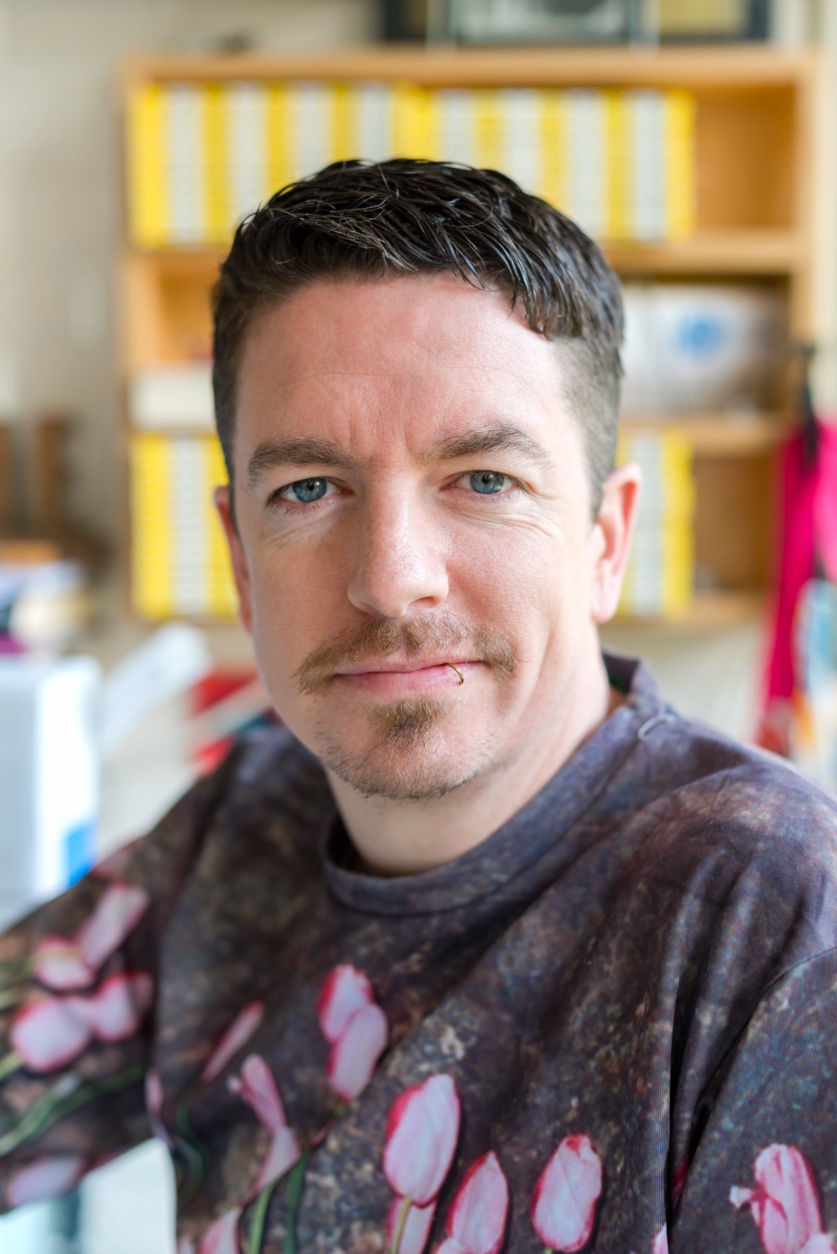 Ray O'Neill smiling at the cake cafe and slice which are both owned by Ray O'Neill