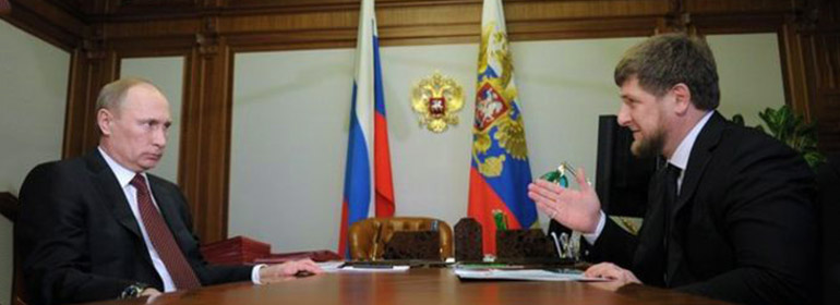 Putin and Chechnya's leader Ramzan Kadyrov sitting at a table as Kadyrov publicly denies gay purge again
